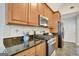 Stylish kitchen featuring stainless steel appliances and granite countertops at 140 Rockglen Ct, Fayetteville, GA 30215