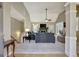 Open concept living room with vaulted ceilings, fireplace, and natural light creating a welcoming space at 140 Rockglen Ct, Fayetteville, GA 30215