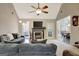 Bright living room features a fireplace, vaulted ceilings, and natural light at 140 Rockglen Ct, Fayetteville, GA 30215