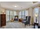 Cozy sitting area in the main bedroom with plenty of natural light at 140 Rockglen Ct, Fayetteville, GA 30215