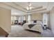 Serene main bedroom with tray ceiling, large windows, and comfortable furnishings at 140 Rockglen Ct, Fayetteville, GA 30215