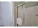 This shower room includes a shower with glass doors, neutral paint, and a towel rack at 140 Rockglen Ct, Fayetteville, GA 30215