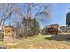 Large backyard with wooded area, a wooden playhouse, and expansive deck, perfect for Gathering gatherings at 149 Crown Glen Way, Stockbridge, GA 30281