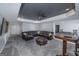 A large basement featuring gray carpet, a large sofa, a game table and a television at 149 Crown Glen Way, Stockbridge, GA 30281