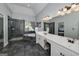 Elegant bathroom featuring a glass shower, soaking tub, and vanity with double sinks at 149 Crown Glen Way, Stockbridge, GA 30281