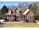 Charming brick home with a manicured front yard and a welcoming entrance at 149 Crown Glen Way, Stockbridge, GA 30281