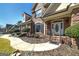 Charming brick home with a welcoming front entrance, featuring an oval glass door and landscaped walkway at 149 Crown Glen Way, Stockbridge, GA 30281