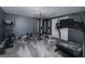Basement gym with various exercise machines and equipment on gray carpet at 149 Crown Glen Way, Stockbridge, GA 30281