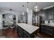 Bright eat-in kitchen with island, stainless refrigerator, and hardwood floors at 149 Crown Glen Way, Stockbridge, GA 30281