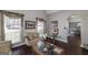 Cozy living room with hardwood floors, decorative curtains, and elegant furniture at 149 Crown Glen Way, Stockbridge, GA 30281