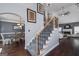 Spacious living area with stairs, fireplace, high ceilings, and open access to dining room at 149 Crown Glen Way, Stockbridge, GA 30281