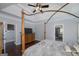 Spacious bedroom with tray ceilings, hardwood floors, and updated ceiling fan at 149 Crown Glen Way, Stockbridge, GA 30281