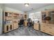 Bright home office features built-in desks, shelving, and a window overlooking the front yard at 149 Crown Glen Way, Stockbridge, GA 30281