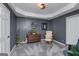 Basement sitting room with decorative accents and neutral color palette at 149 Crown Glen Way, Stockbridge, GA 30281