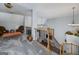 An upstairs area with gray carpet, decorative railings and stairs leading to the main level at 149 Crown Glen Way, Stockbridge, GA 30281