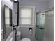 Bathroom featuring a shower with sliding glass doors and updated fixtures at 1165 Fair Sw St, Atlanta, GA 30314