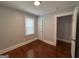 Cozy bedroom featuring hardwood floors and a window for natural light at 1165 Fair Sw St, Atlanta, GA 30314