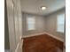 Bedroom featuring hardwood floors and natural light from two windows at 1165 Fair Sw St, Atlanta, GA 30314