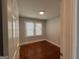 Bedroom with hardwood floors and natural light streaming in from a window at 1165 Fair Sw St, Atlanta, GA 30314