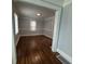 Dining room with beautiful hardwood floors, wainscotting, and ample natural light at 1165 Fair Sw St, Atlanta, GA 30314