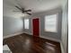 Inviting living room featuring gleaming hardwood floors, two windows, and a contemporary ceiling fan at 1165 Fair Sw St, Atlanta, GA 30314