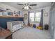 bedroom with blue accent wall and neutral carpet at 120 Fountain Head, Peachtree City, GA 30269
