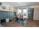 Charming dining room with wainscoting, natural wood table, and built-in display cabinet at 120 Fountain Head, Peachtree City, GA 30269