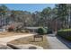 This single Gathering home is surrounded by a lot of trees in a rural neighborhood at 120 Fountain Head, Peachtree City, GA 30269