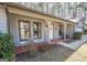 Home featuring a welcoming front porch with a seating area and charming decor at 120 Fountain Head, Peachtree City, GA 30269