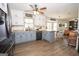 Open-concept kitchen flowing into the living space, featuring stainless appliances and center island at 120 Fountain Head, Peachtree City, GA 30269