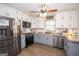 Bright kitchen featuring stainless steel appliances, neutral countertops, and ample cabinet space at 120 Fountain Head, Peachtree City, GA 30269
