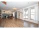 Bright living room with a dining table, large windows, and natural light at 120 Fountain Head, Peachtree City, GA 30269