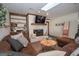 Comfortable living room featuring a brick fireplace and skylight at 120 Fountain Head, Peachtree City, GA 30269