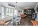 Bright living room with bay window, modern light fixture and ceiling fan at 120 Fountain Head, Peachtree City, GA 30269