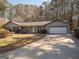 Cozy living room boasts wood floors, natural light, and a fireplace at 120 Fountain Head, Peachtree City, GA 30269