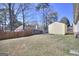 Backyard with a fence, shed and grass at 2808 Autumn Lake Ln # D/6, Decatur, GA 30034