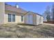Backyard with a shed and a house with yellow siding, showing trees and grass at 2808 Autumn Lake Ln # D/6, Decatur, GA 30034