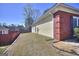 The house with the yellow siding, brick corner and the brown backyard at 2808 Autumn Lake Ln # D/6, Decatur, GA 30034