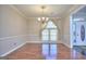 Dining room with hardwood floors, chandelier and a window overlooking the front yard at 2808 Autumn Lake Ln # D/6, Decatur, GA 30034