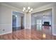 Dining room with hardwood floors and a view into a living area with a fireplace at 2808 Autumn Lake Ln # D/6, Decatur, GA 30034