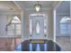 Bright foyer featuring black tile flooring and a decorative front door with glass sidelights at 2808 Autumn Lake Ln # D/6, Decatur, GA 30034