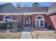Welcoming home entrance with an arched glass front door and decorative landscaping at 2808 Autumn Lake Ln # D/6, Decatur, GA 30034