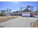 Ranch home with brick facade, two-car garage, and a well-manicured front yard with a long concrete driveway at 2808 Autumn Lake Ln # D/6, Decatur, GA 30034
