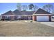 Charming single-story brick home with an attached two-car garage and a well-manicured lawn at 2808 Autumn Lake Ln # D/6, Decatur, GA 30034