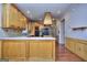 Open kitchen design showcasing wood cabinets, island, and wood flooring at 2808 Autumn Lake Ln # D/6, Decatur, GA 30034
