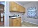 Laundry area features neutral paint, window with patterned curtain, and built in storage at 2808 Autumn Lake Ln # D/6, Decatur, GA 30034