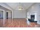 Vaulted ceiling living room with fireplace, wood floors, and entry view at 2808 Autumn Lake Ln # D/6, Decatur, GA 30034