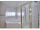 Bright main bathroom with corner tub, shower and neutral decor at 2808 Autumn Lake Ln # D/6, Decatur, GA 30034