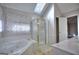 This modern main bathroom features a skylight, bathtub, and glass enclosed shower at 2808 Autumn Lake Ln # D/6, Decatur, GA 30034