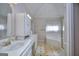 Bright main bathroom features dual sinks, a large mirror, and a glass-enclosed shower at 2808 Autumn Lake Ln # D/6, Decatur, GA 30034